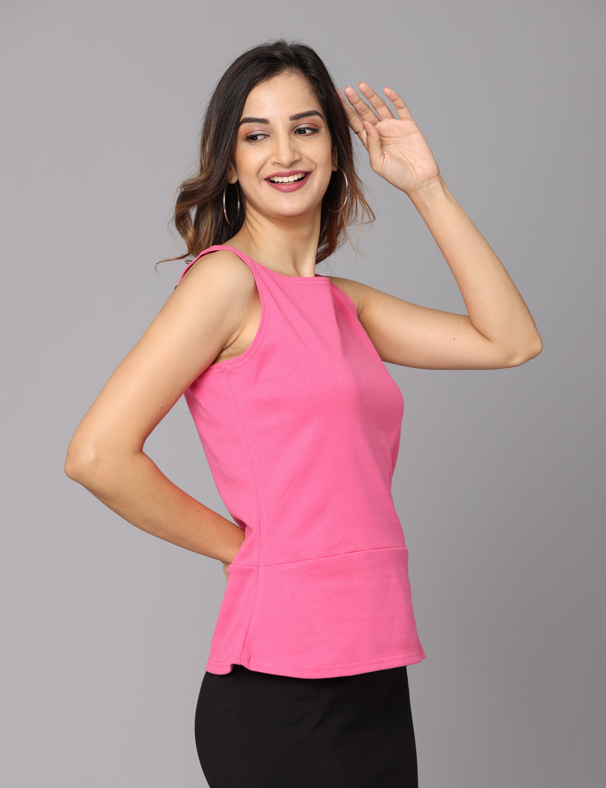 Solid knit pink peplum top